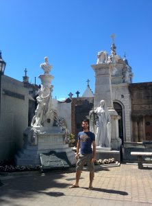 The author in front of graves and chapels in cemetery Recoleta.