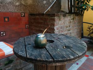 A bowl of mate and a bombilla. The name Eric is written on the bowl.