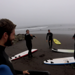 5 people warming up for surfing