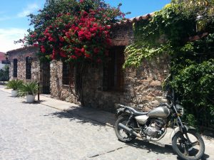 A house in stones with a moto