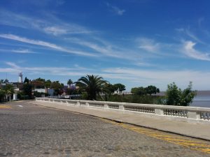 A road in the town of Colonia with the lighthouse far away