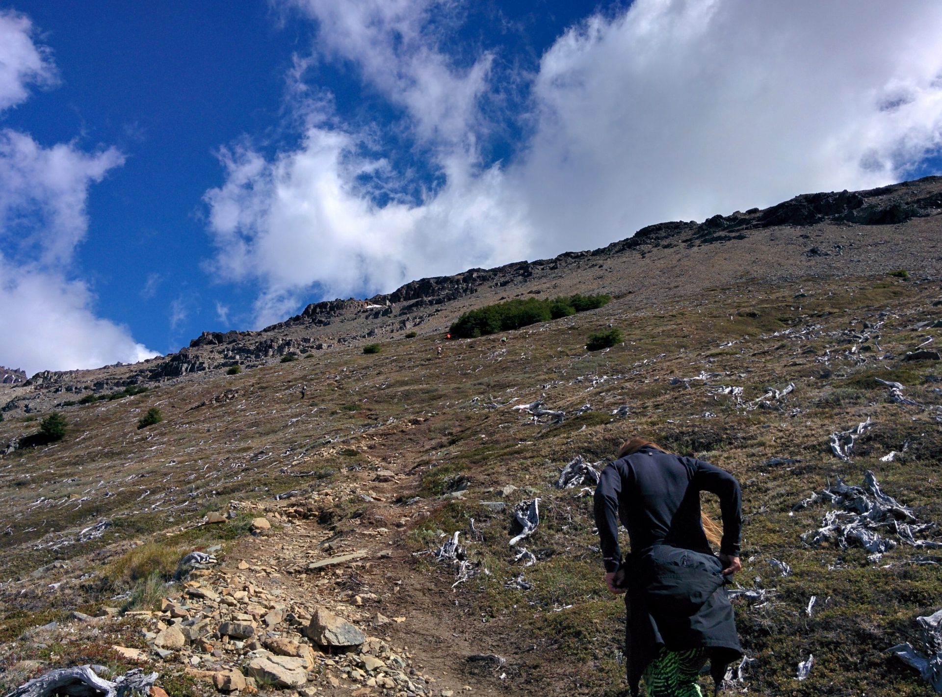 The dry steep way up and a girl climbing it.