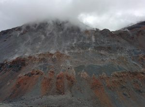 A face of the volcano where smoke are going out