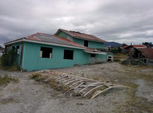 A house, devasted by an eruption, surrounded by 1.5 meters of ashes