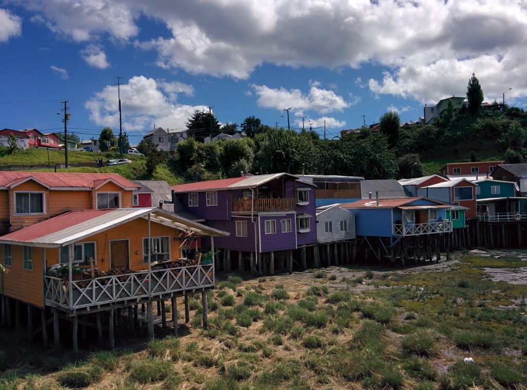 Wood houses on stilts in many colors