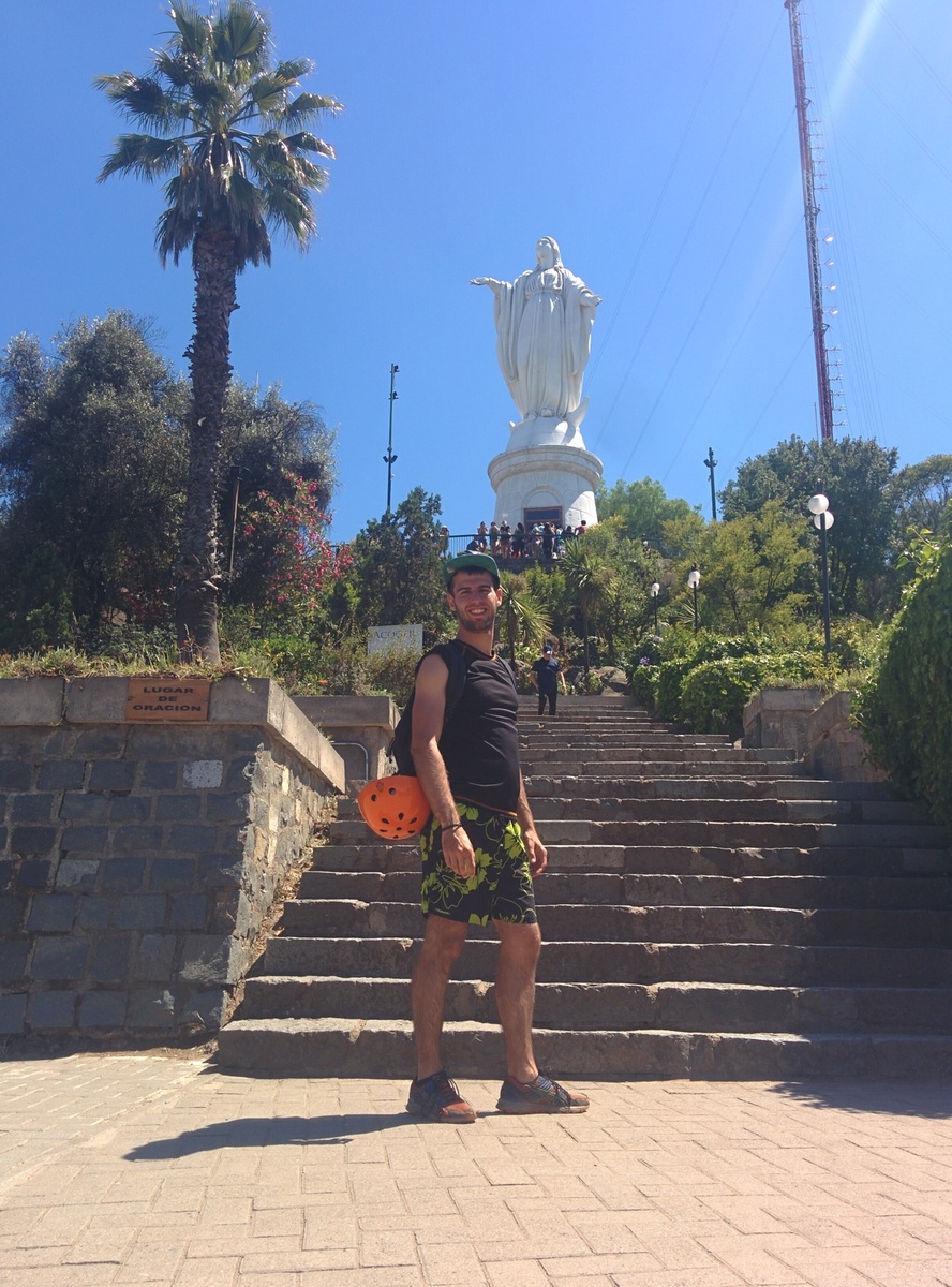 Me in front of a big white statue of the virgin.