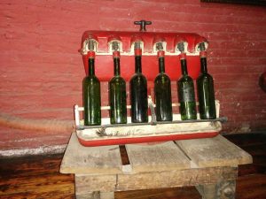 An old red motor transformed with bottles instead of valves