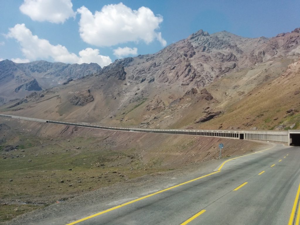 A road in the middle of mountains.