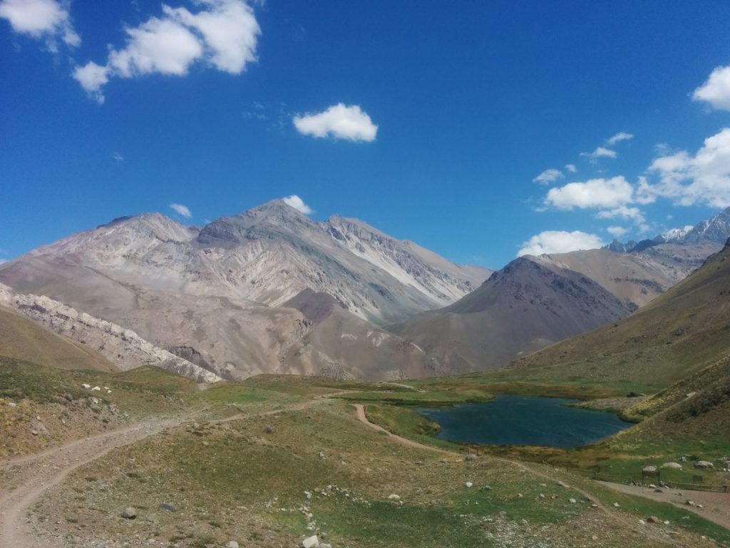 A green-blue lake with mountains