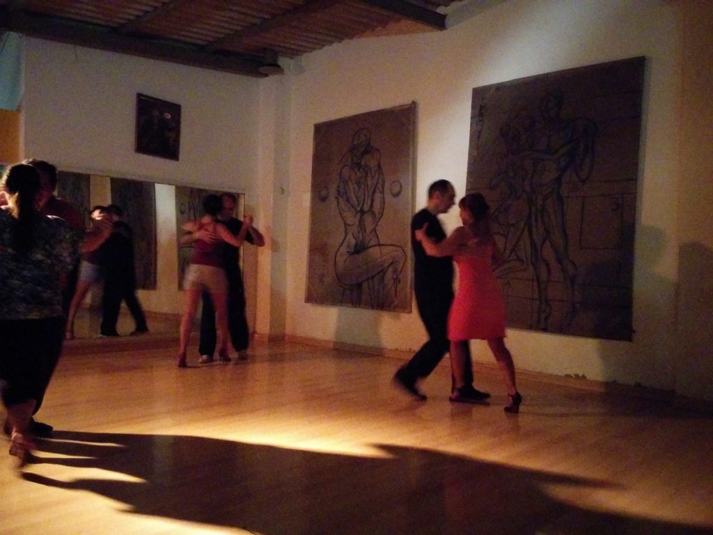 A dancefloor where people dances Tango
