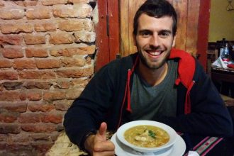 A meal with bean, corn, pumpkin and meat.